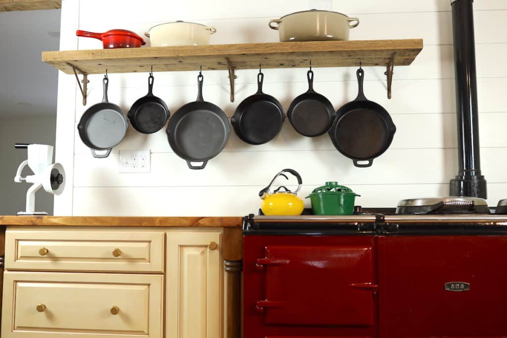 underside of farmhouse shelf hanging cast irons