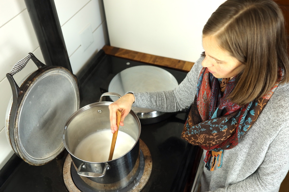stirring pot of milk making dulce de leche
