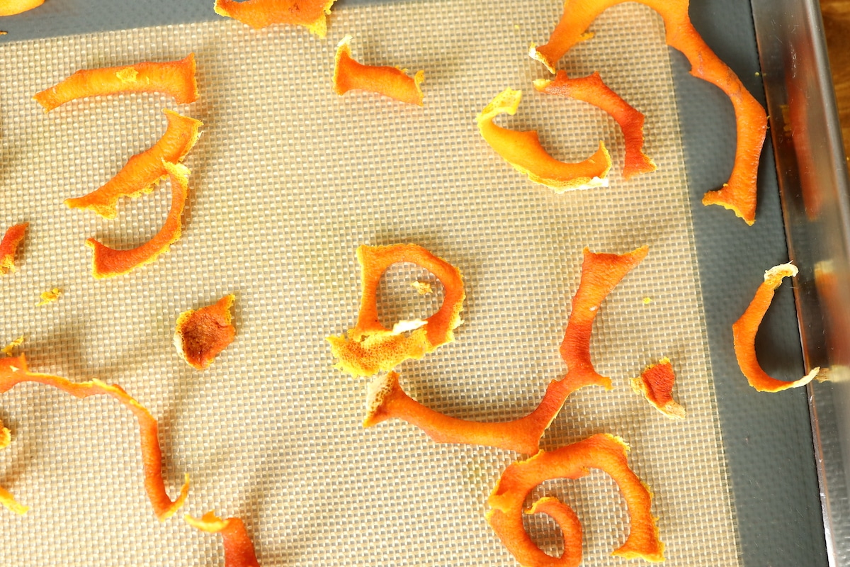 dried orange peels on cookie sheet
