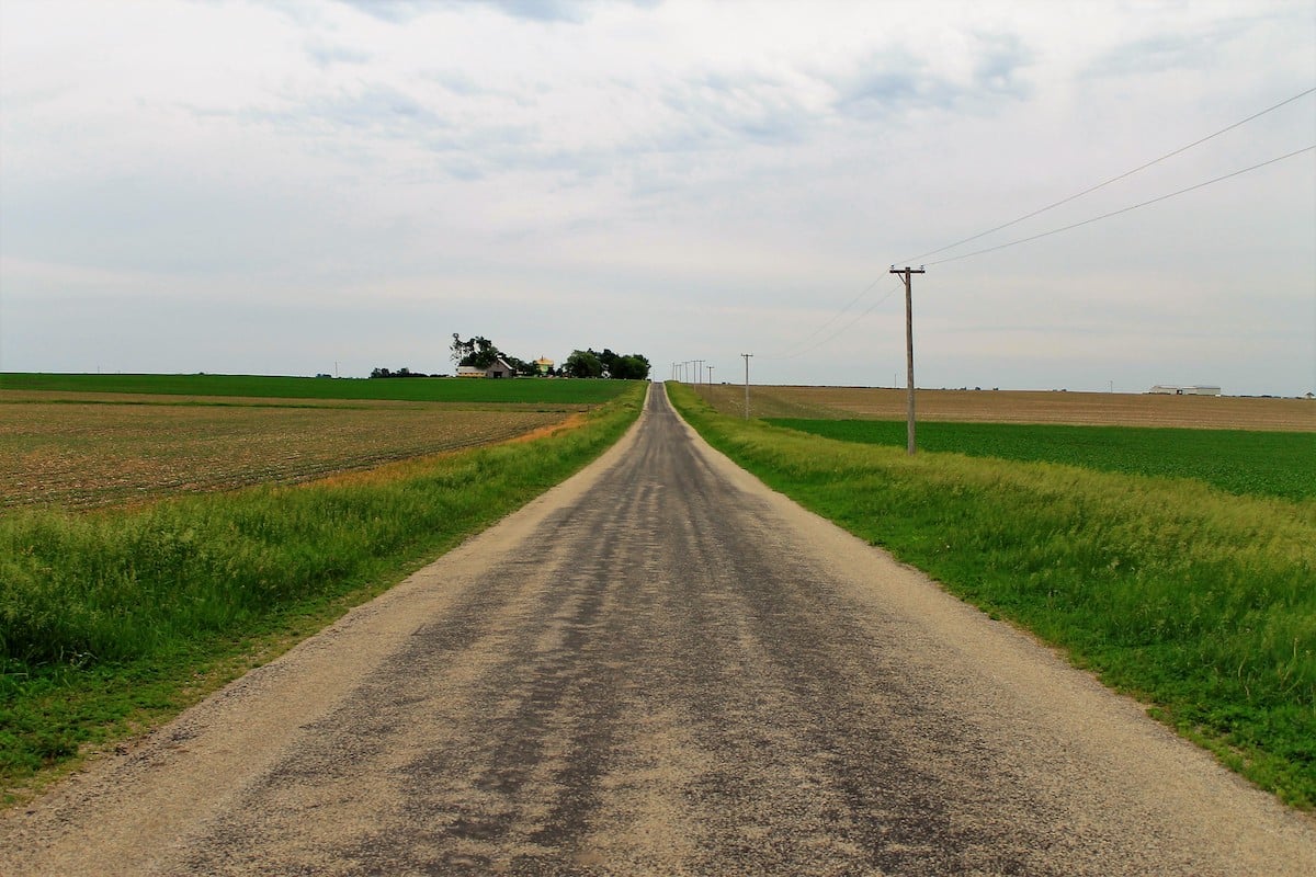 country road with farm fields