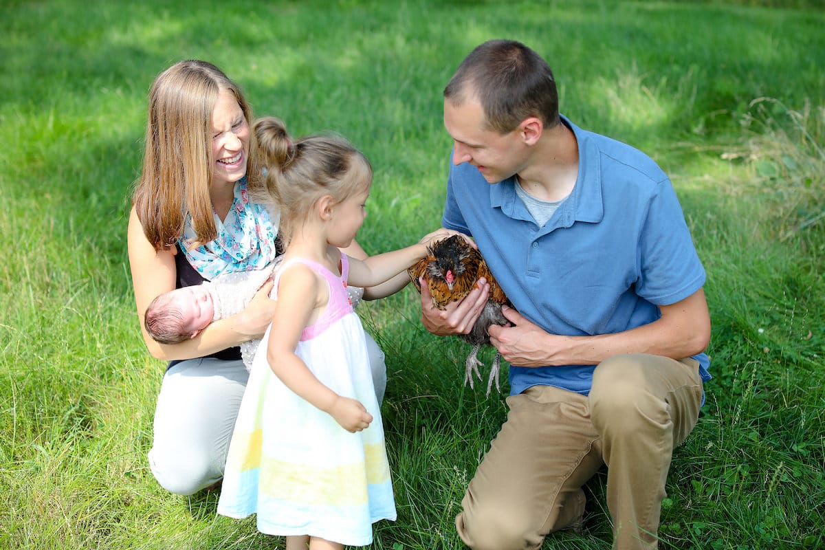 family with backyard chickens
