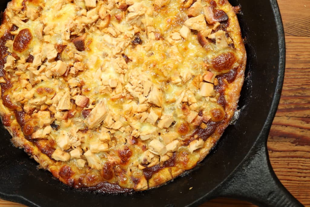 shredded chicken on cheesy egg pizza