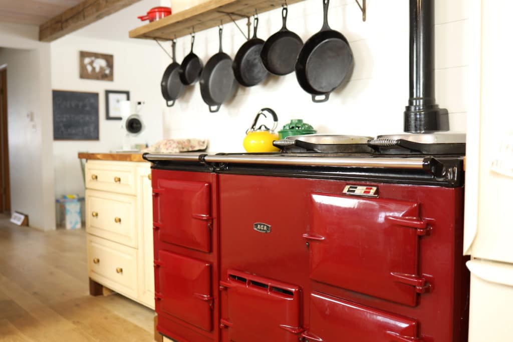 aga stove with farmhouse shelf