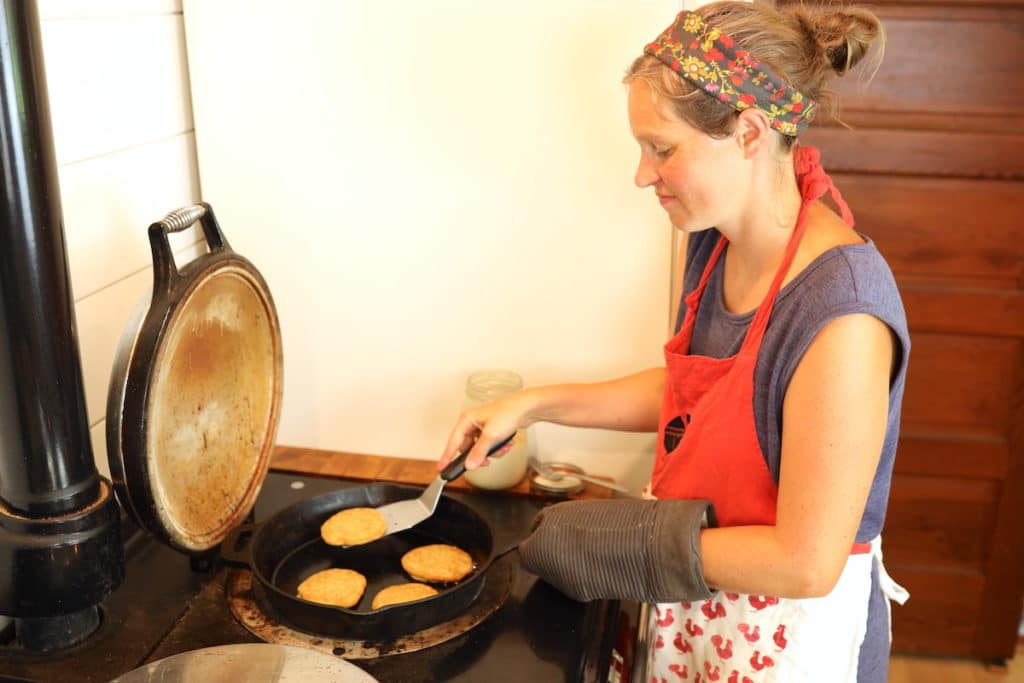flipping sourdough pancakes on cast iron pan