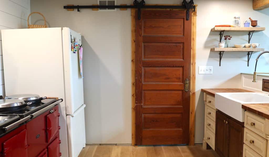 aintique sliding barn door in farmhouse kitchen