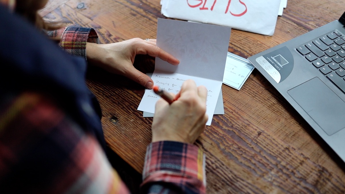 writing a note of encouragement to a samaritan member