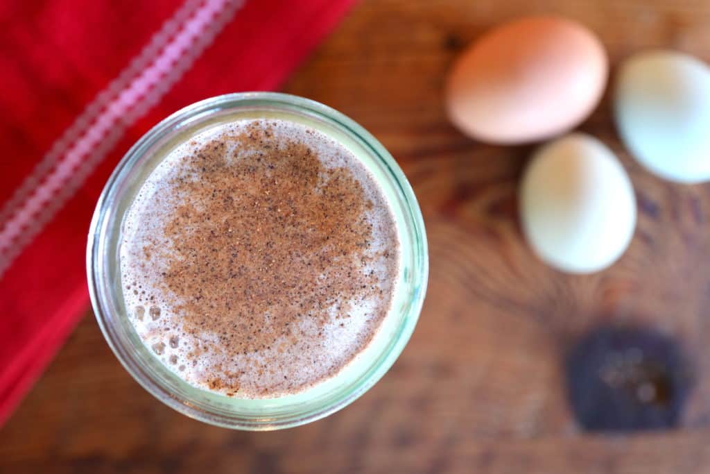 raw eggnog topped with nutmeg