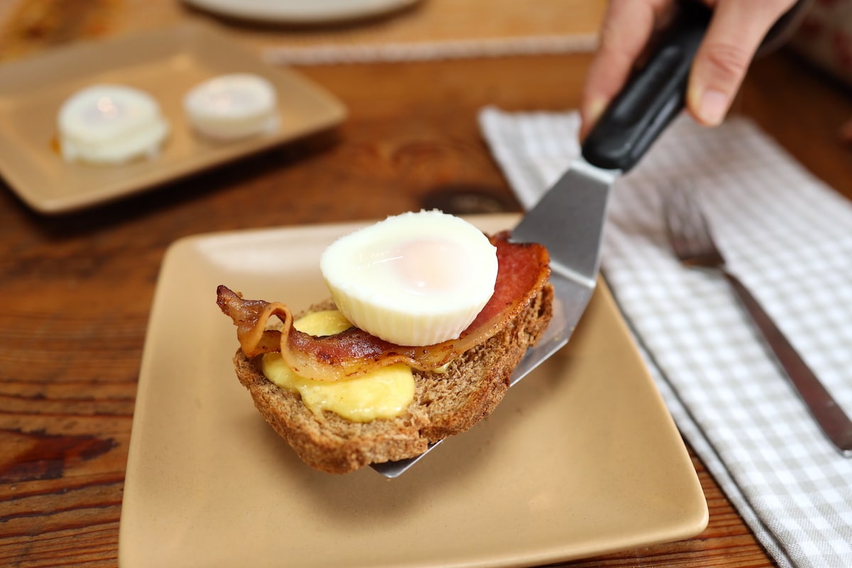 serving up a poached egg breakfast sandwich