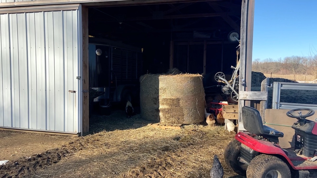 round hay bale in pole barn