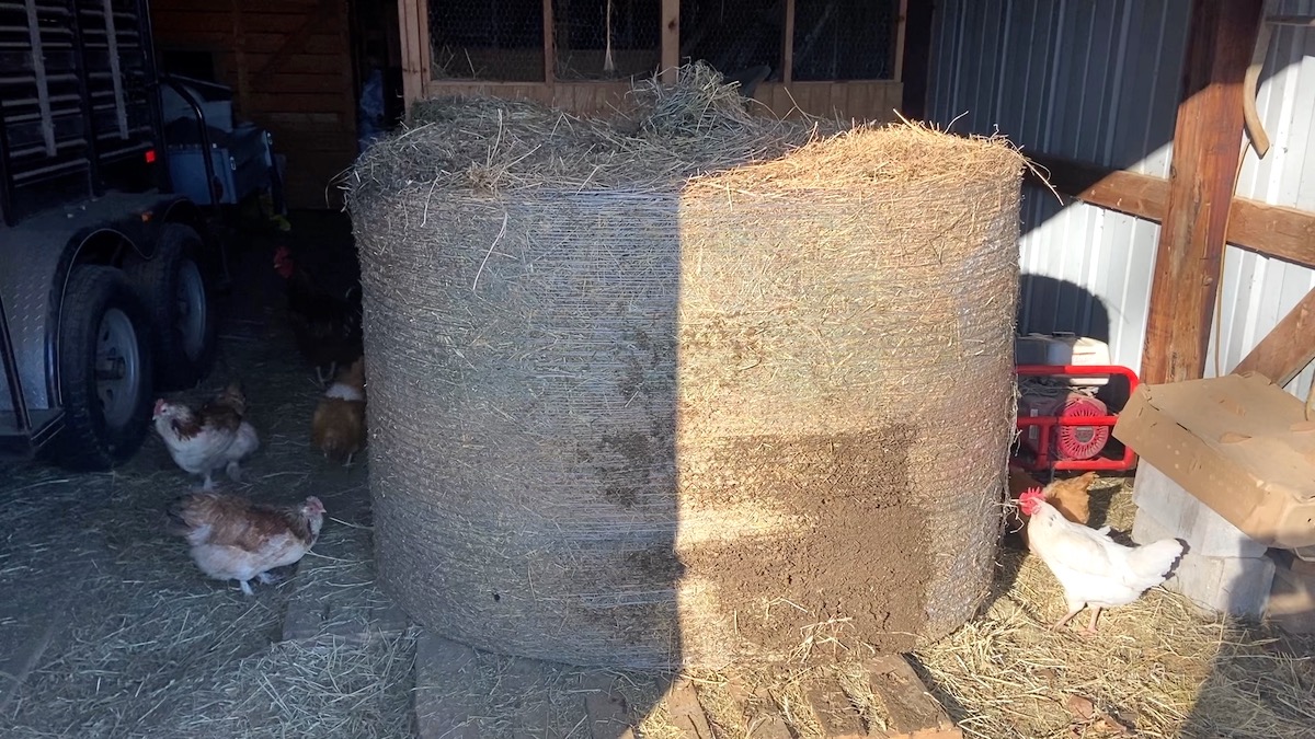 round hay bale stored flat side down in barn