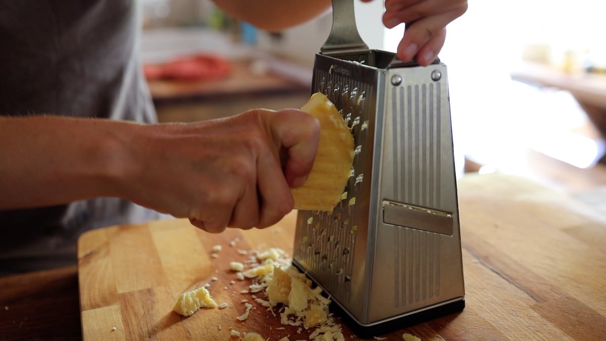 grating cheddar by hand for mac and cheese
