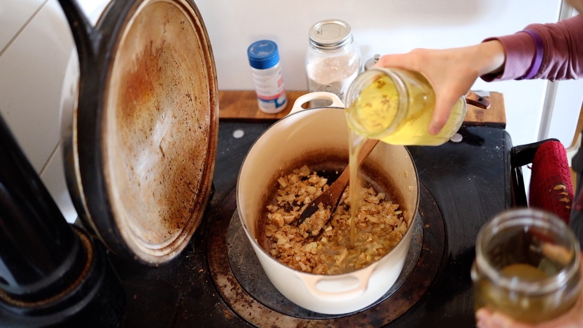 adding broth to soup roux