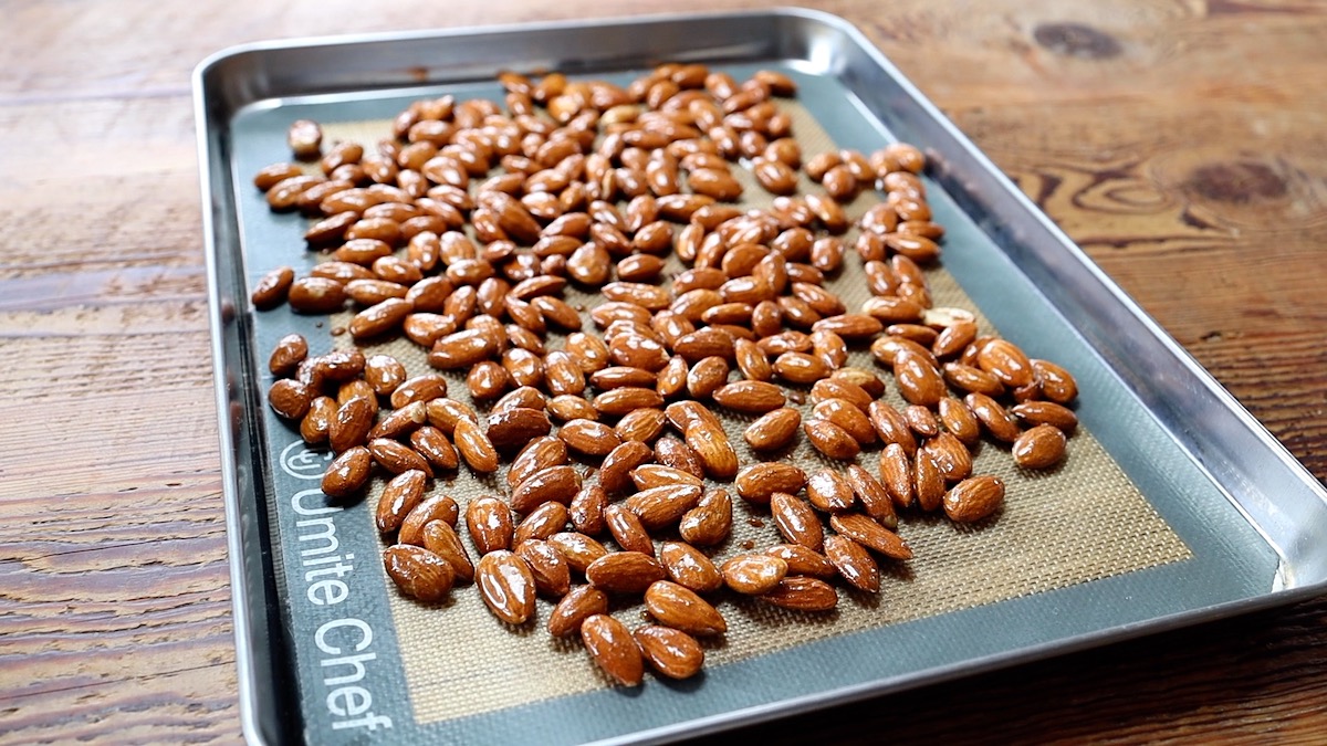 maple roasted almonds on pan before baking