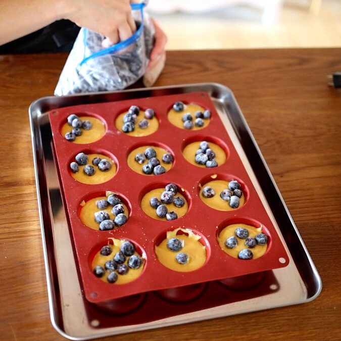 adding blueberries to gluten free blender muffins