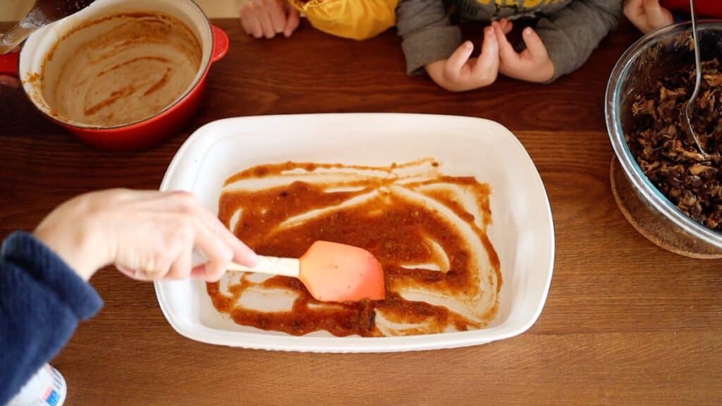 layer of enchilada sauce at bottom of casserole