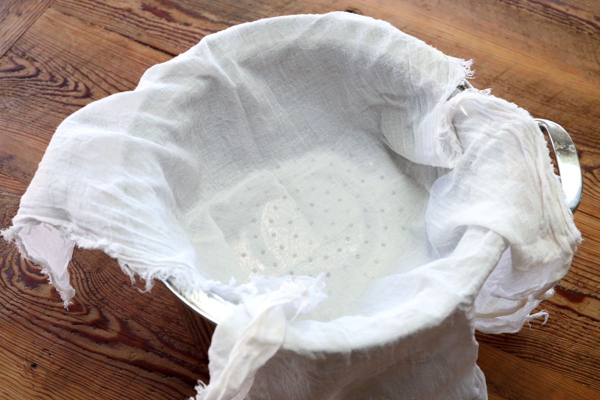 cheesecloth in strainer to render tallow