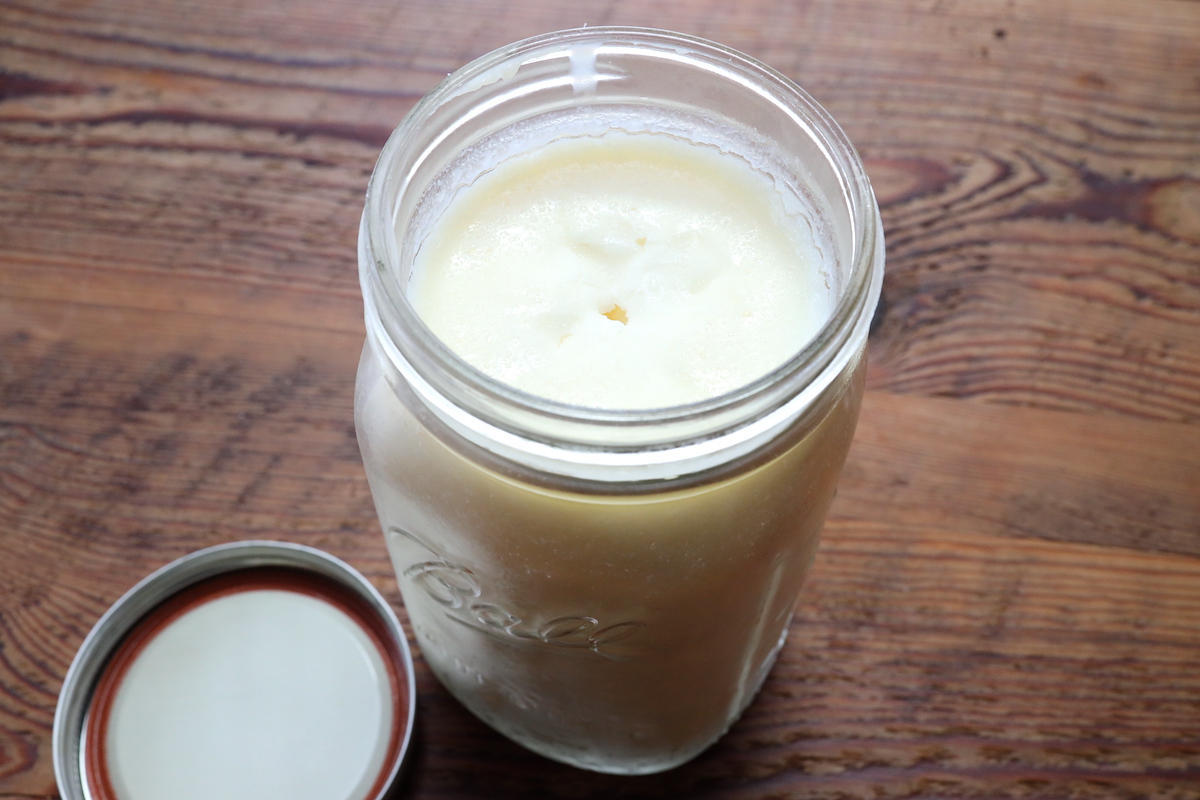 mason jar of wet rendered tallow for skin care products