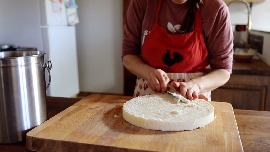 scraping impurities from tallow disk