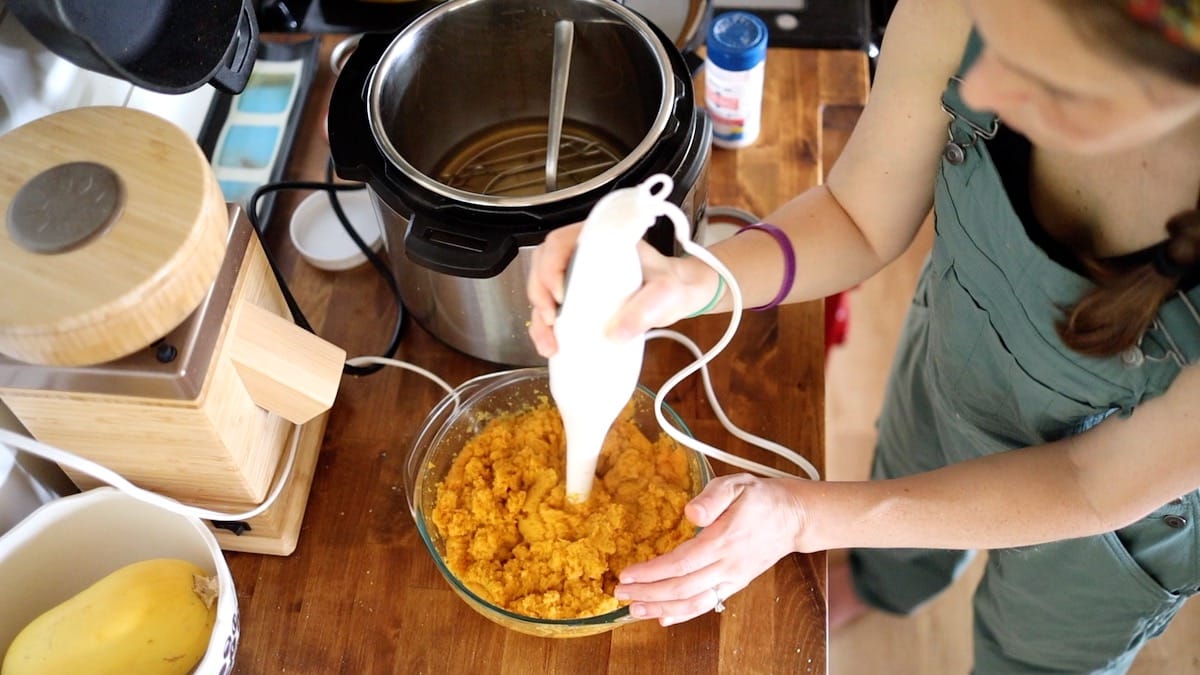 mashing carrots with immersion blender