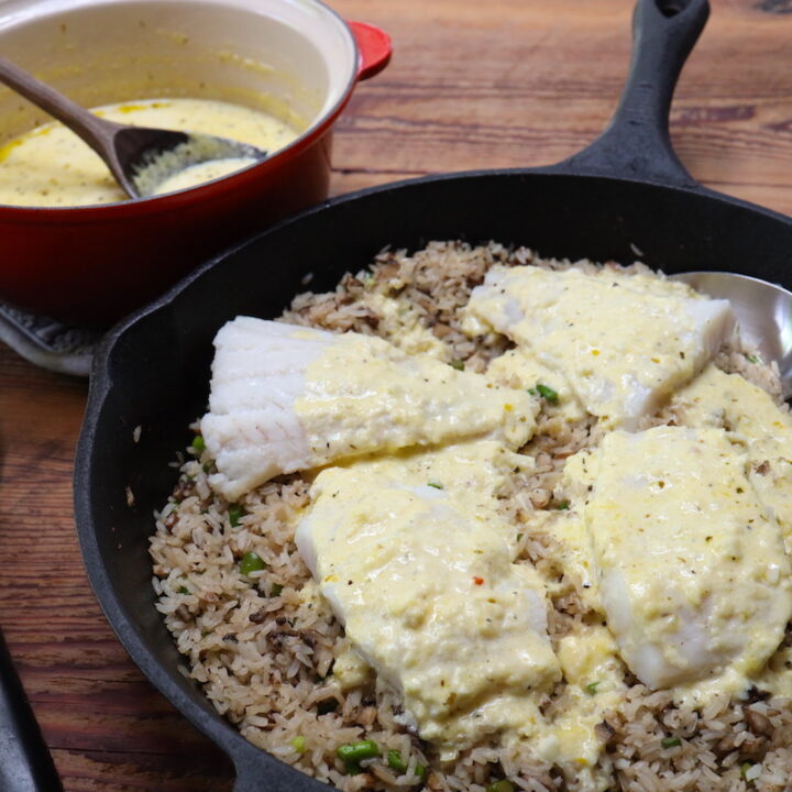 cheesy cream sauce served on fish and rice