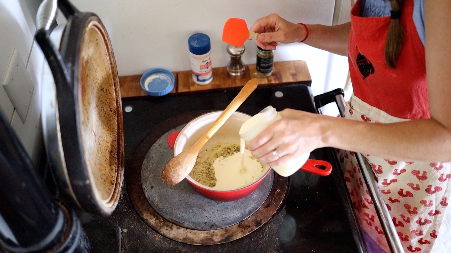 pouring in cream for cream sauce recipe