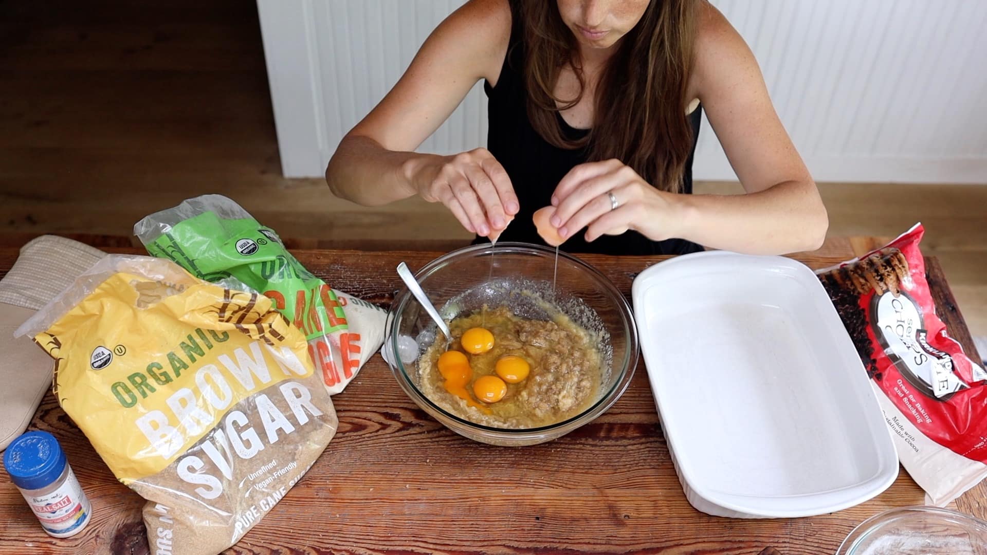 adding eggs to cookie cake batter