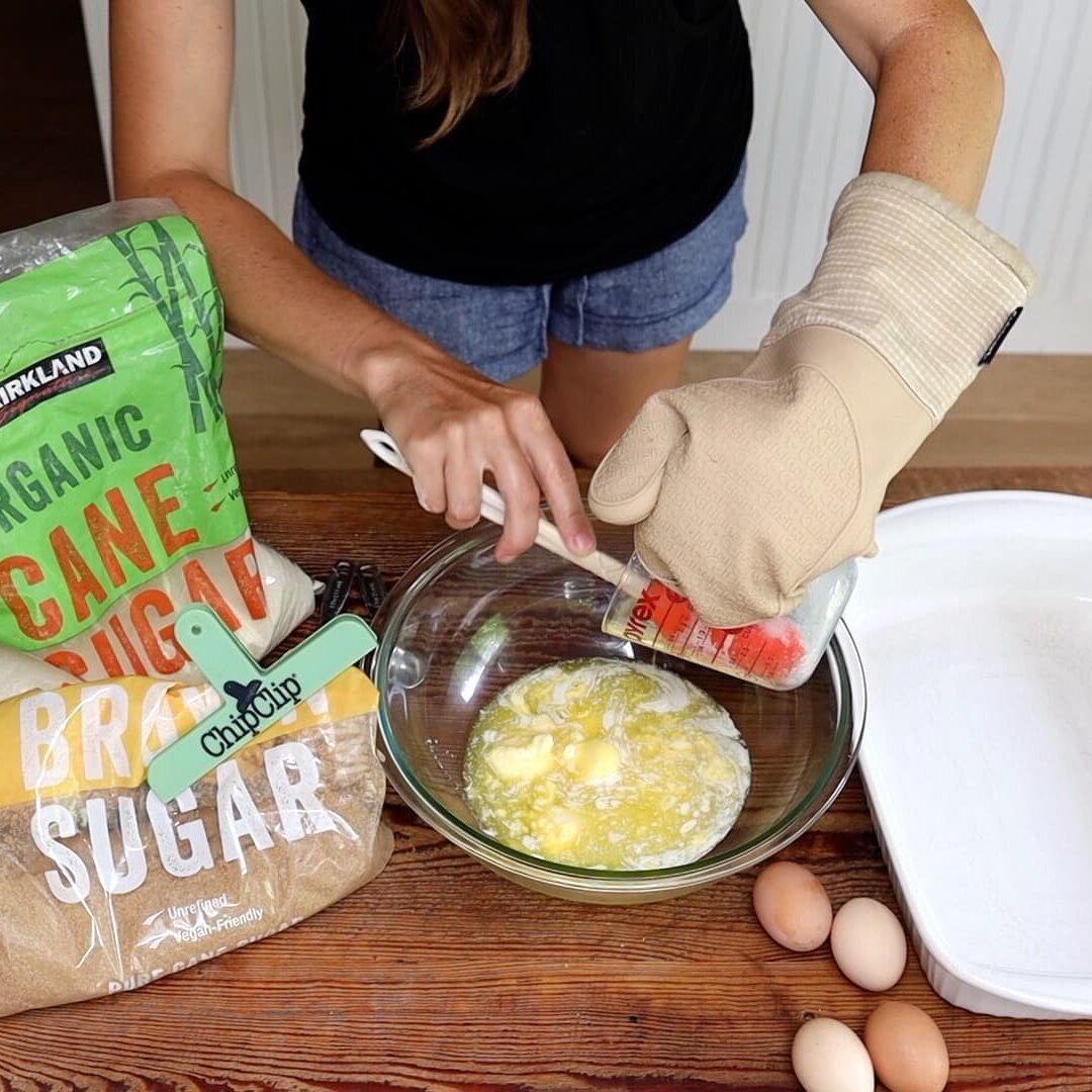 adding melted butter and coconut oil to mixing bowl