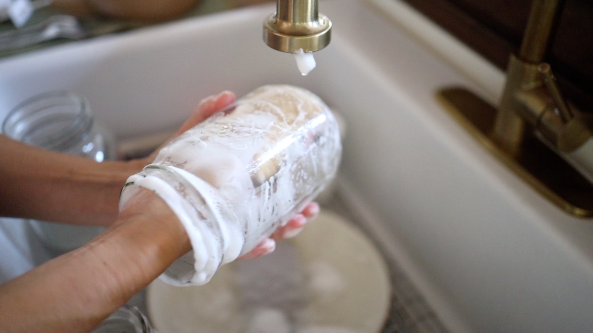 doing dishes using homemade dish soap bar