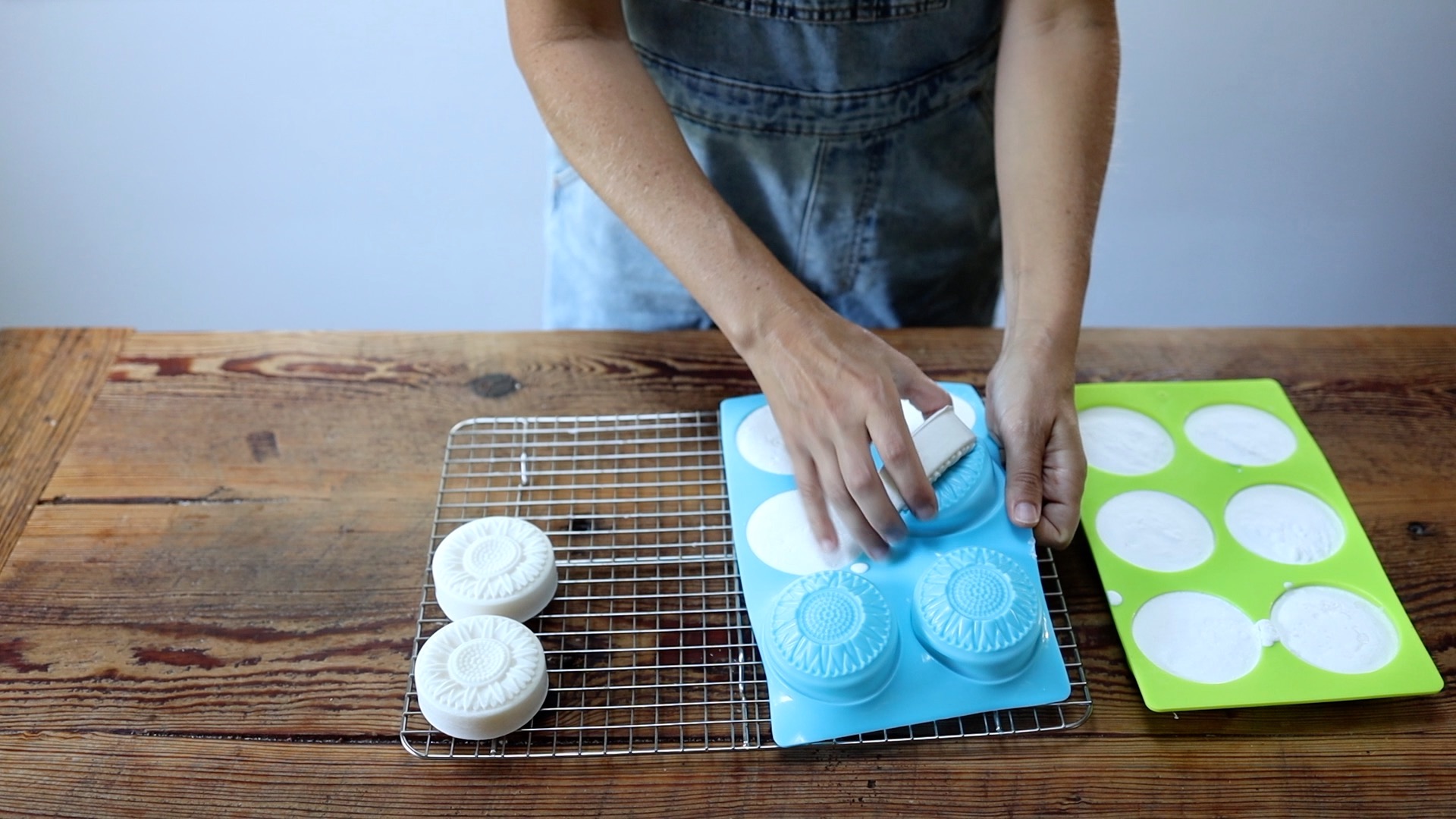 popping dish soap bars out of soap molds