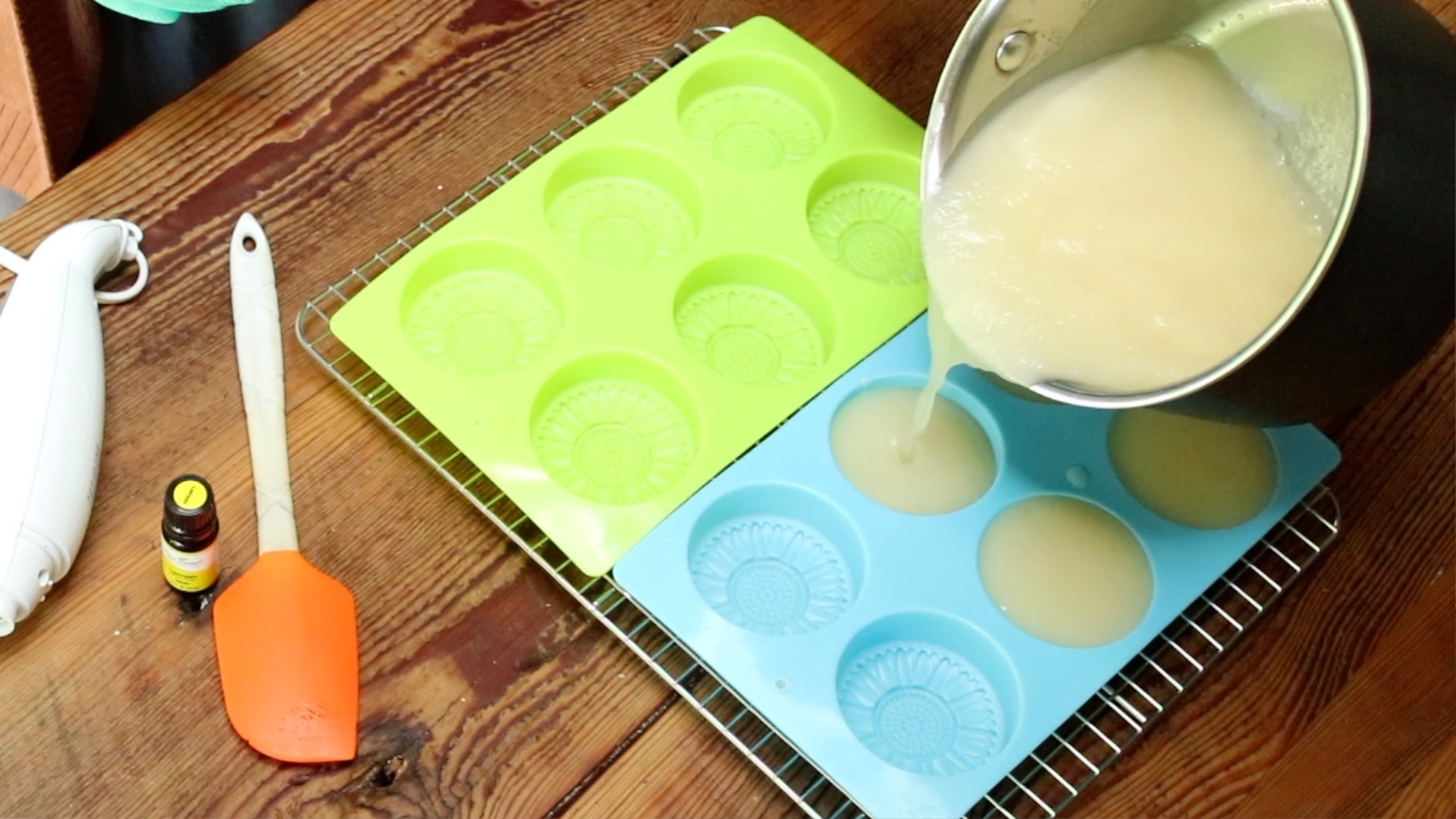 pouring dish soap bars into soap molds