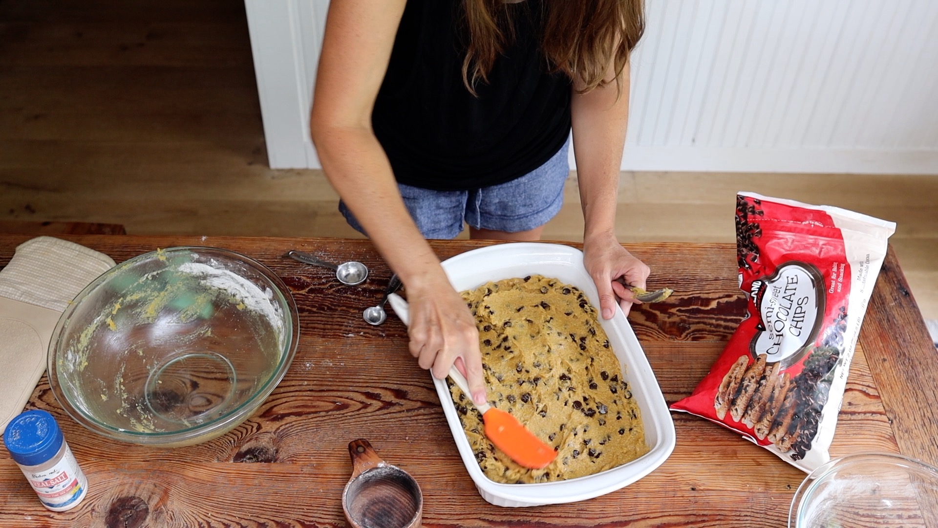 spreading out cookie cake batter in pan