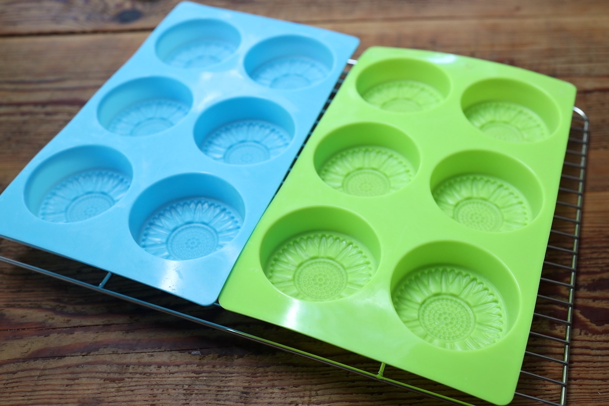 sunflower soap molds on drying rack