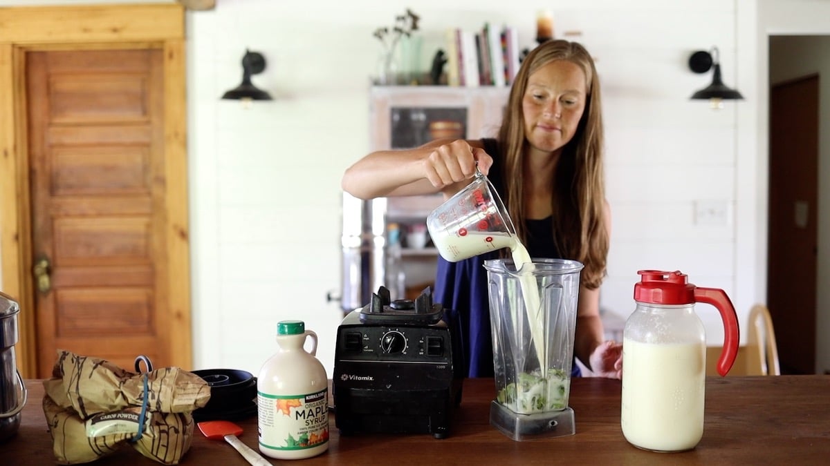 pouring milk into blender for fudgesicles