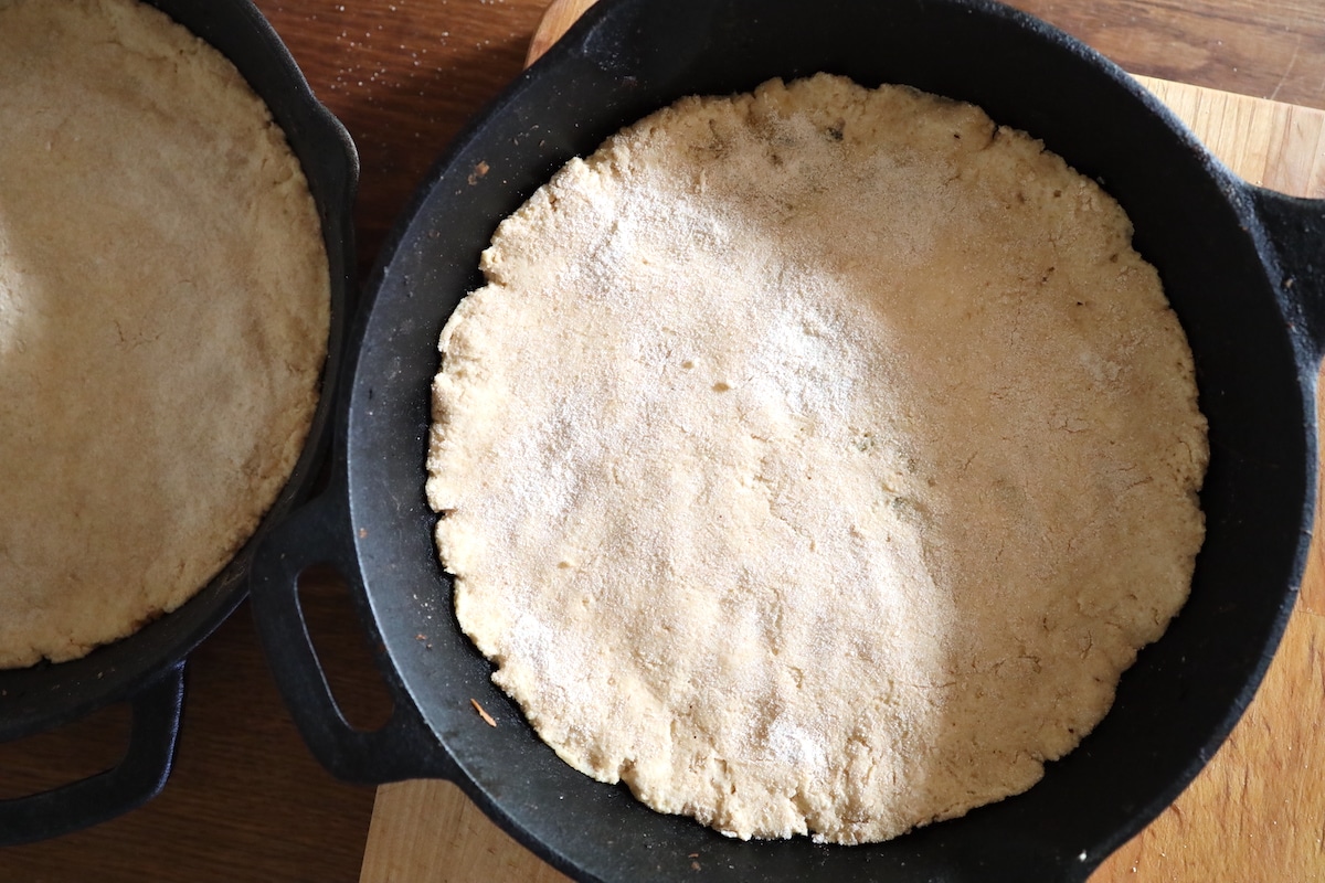 yogurt pizza dough in cast iron pan