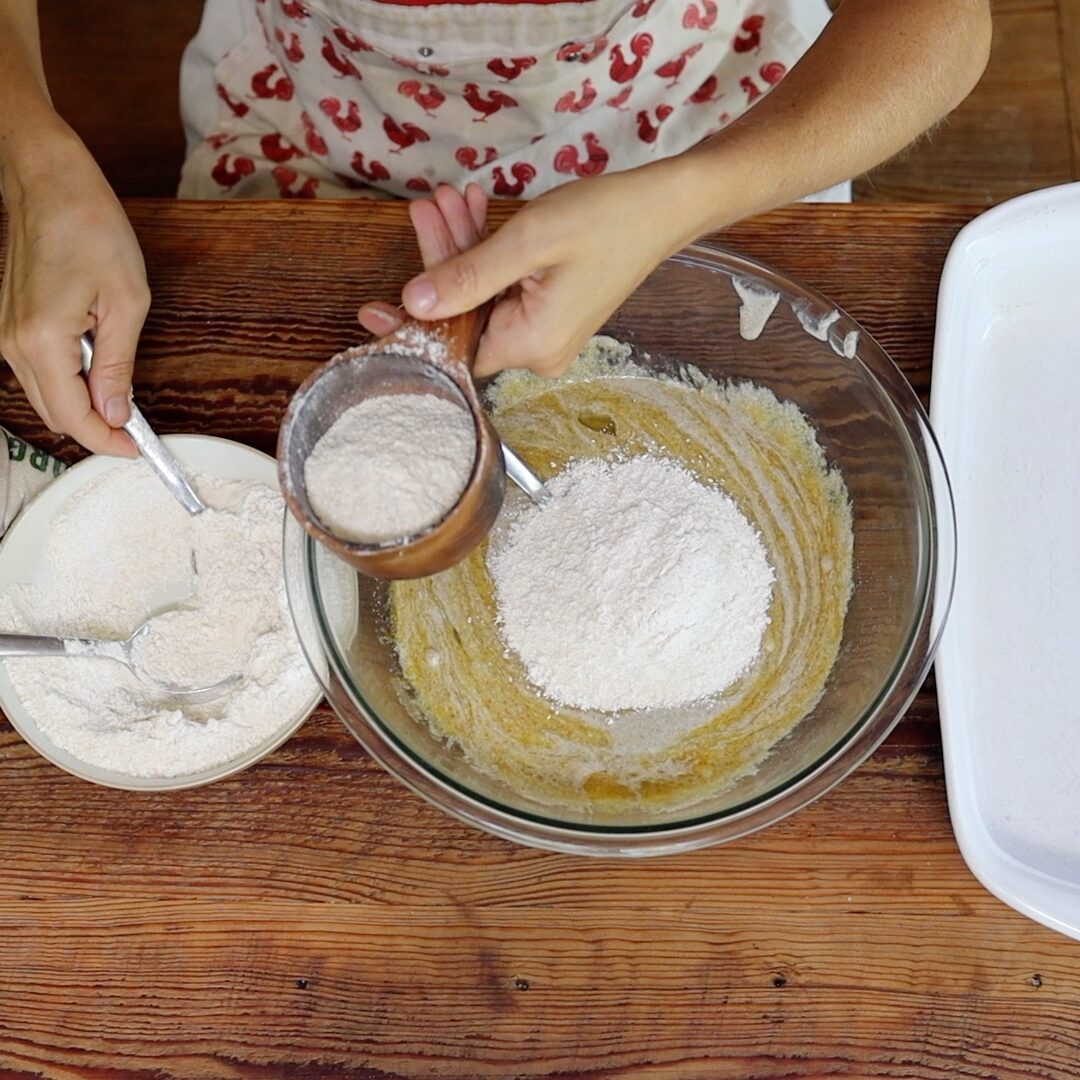 adding flour to sourdough blondies batter