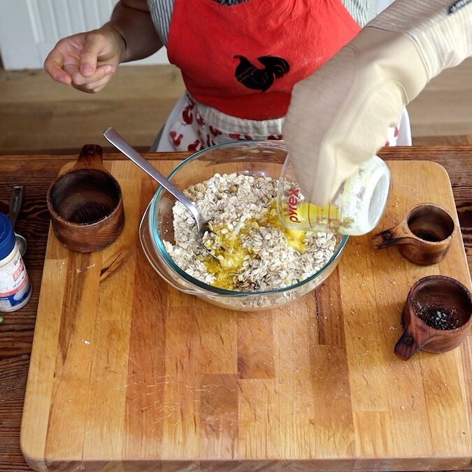 pouring in melted butter for topping