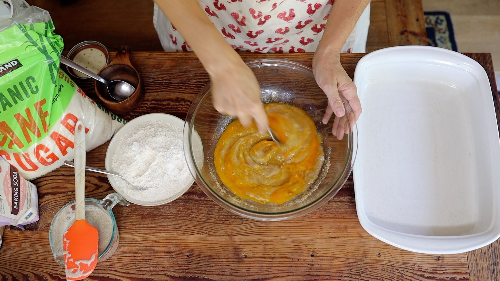 stirring in eggs to cookie bar batter