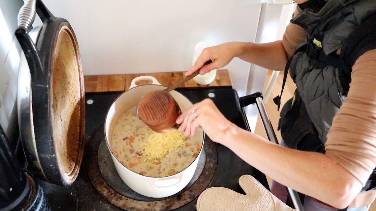 adding cheese to soup