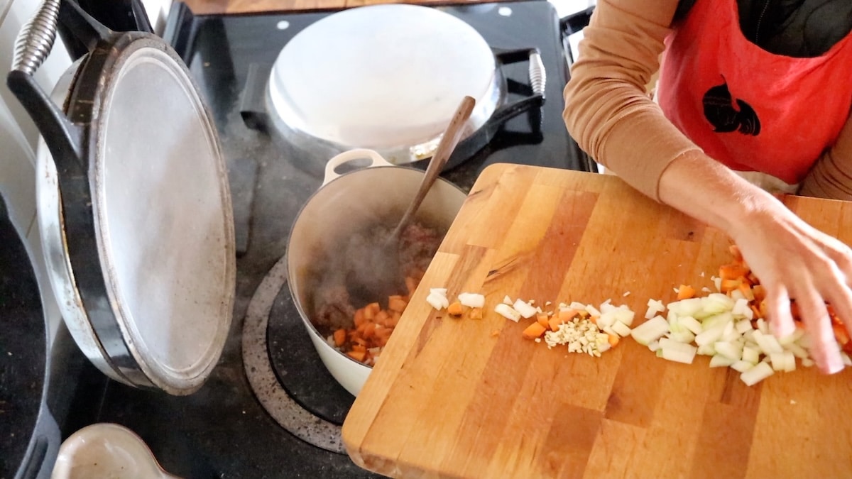 adding chopped veggies