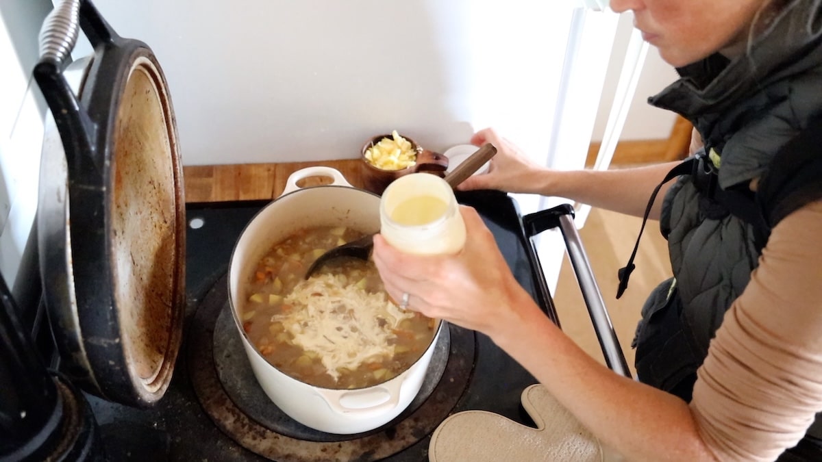 adding cream to soup