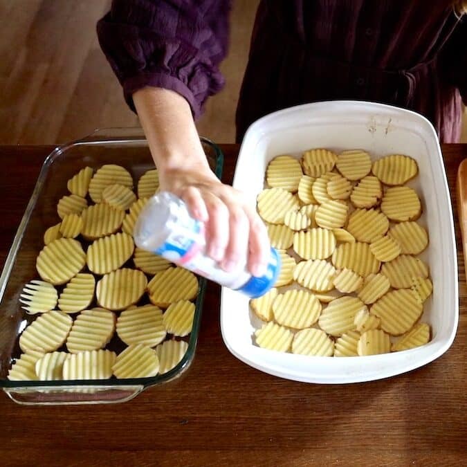 adding salt to crinkle cut potatoes