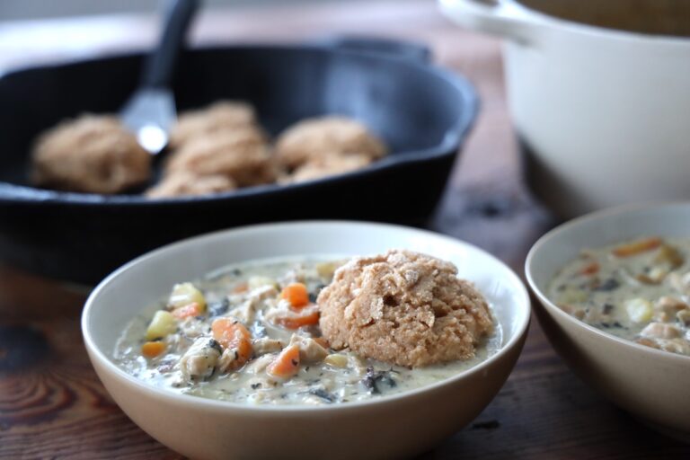 chicken pot pie soup topped with biscuit