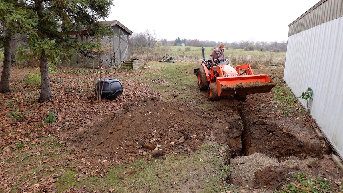 backfilling holes with tractor bucket