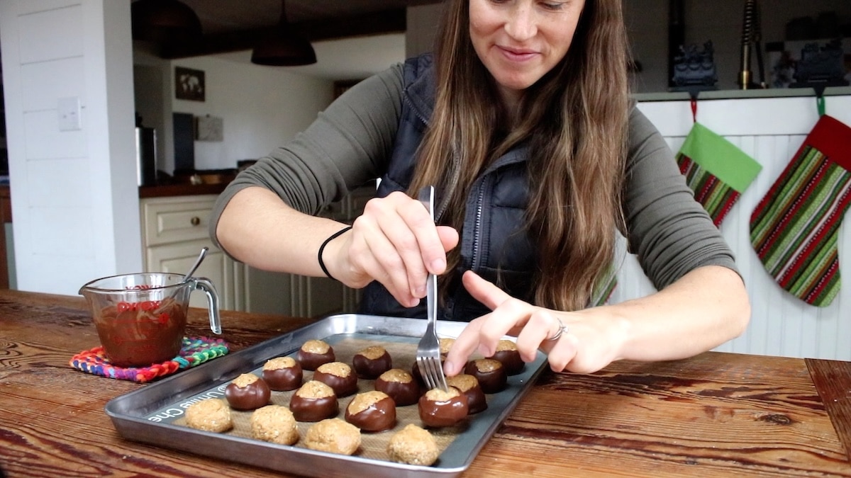 dipping buckeye balls in chocolate