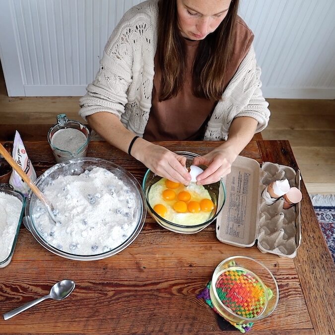 adding eggs for muffins