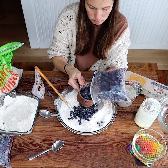 adding frozen blueberries for muffins