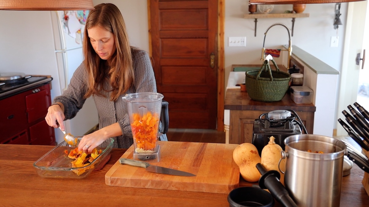 adding roasted butternut squash to blender