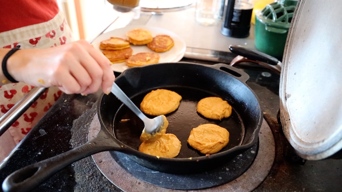 scooping batter for oatmeal pumpkin pancakes