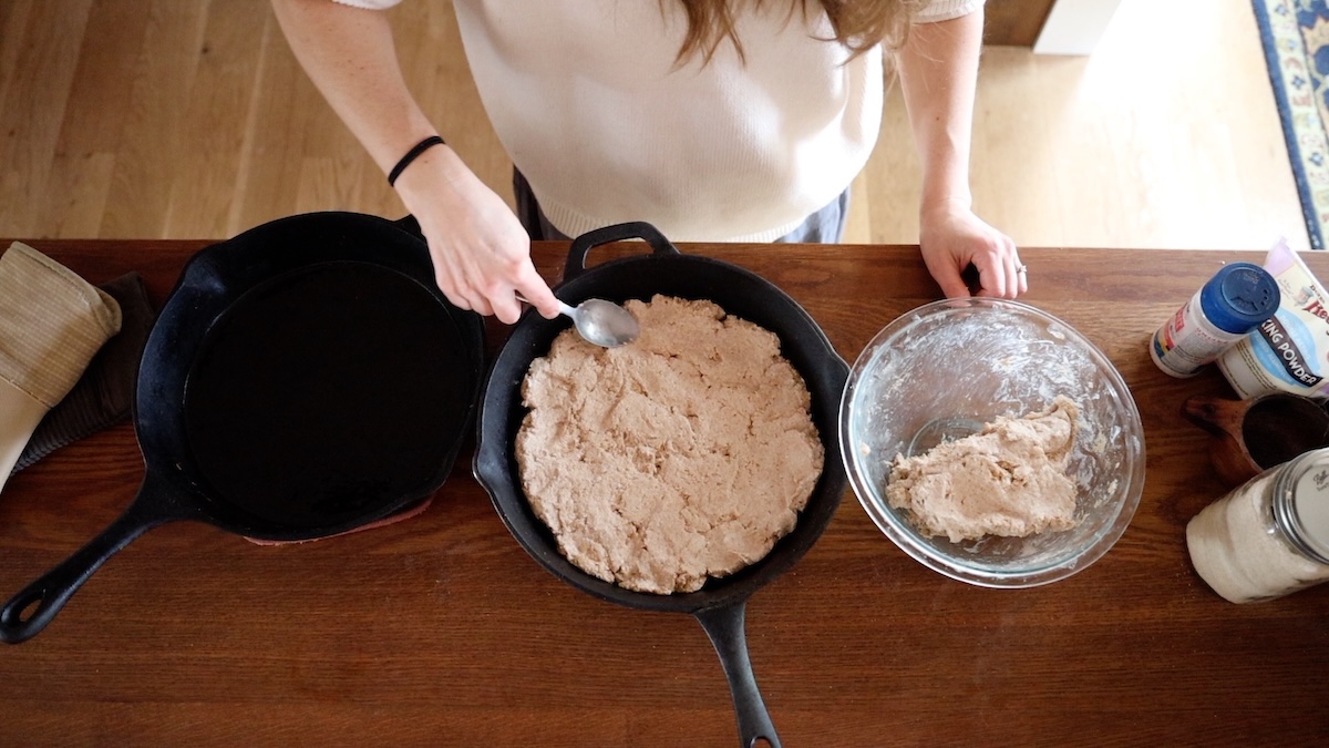 spreading pizza dough