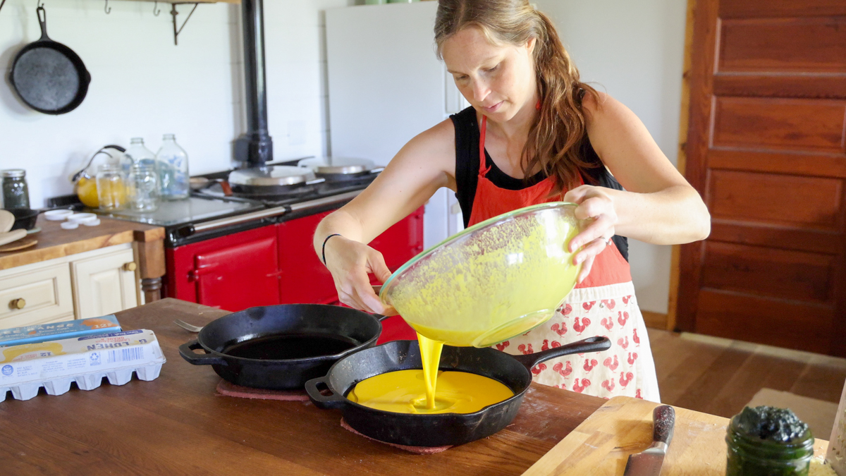 pouring batter into hot and greased pan
